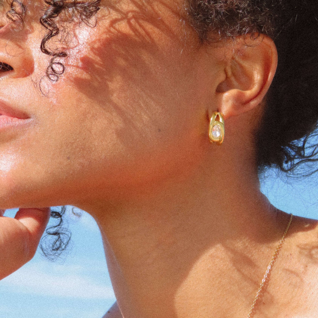 Aurelia CZ Huggie Earrings | 18k Gold Plated, Oval Solitaire 1