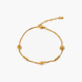 Dalia Daisy Chain Anklet in 18k gold plating, featuring a waterproof design and adjustable length for a perfect fit. 0