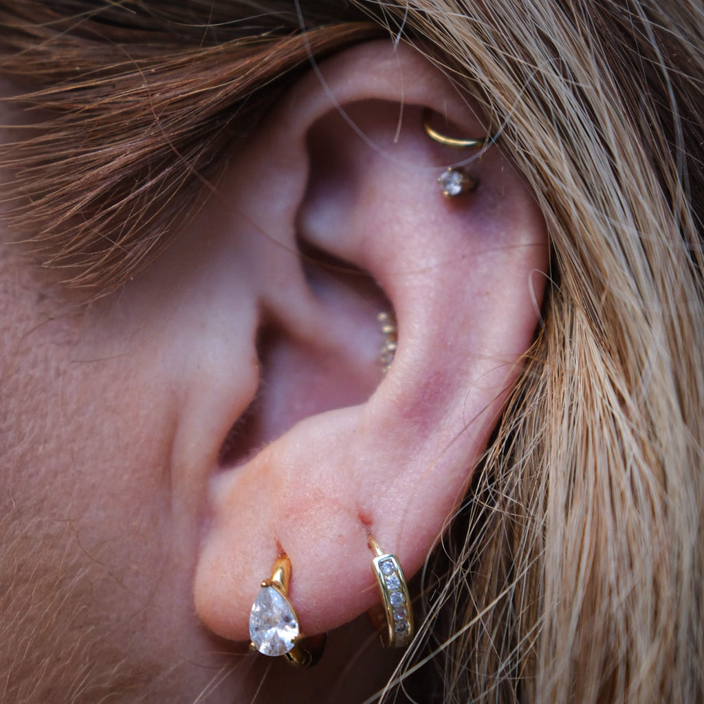 Pearla CZ Huggie Earrings | 18k Gold Plated, Pear-Shaped Gemstone 4
