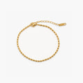 Riven Gold Anklet featuring an 18k gold plated finish with an adjustable rice bead design for a stylish and customizable fit. 0