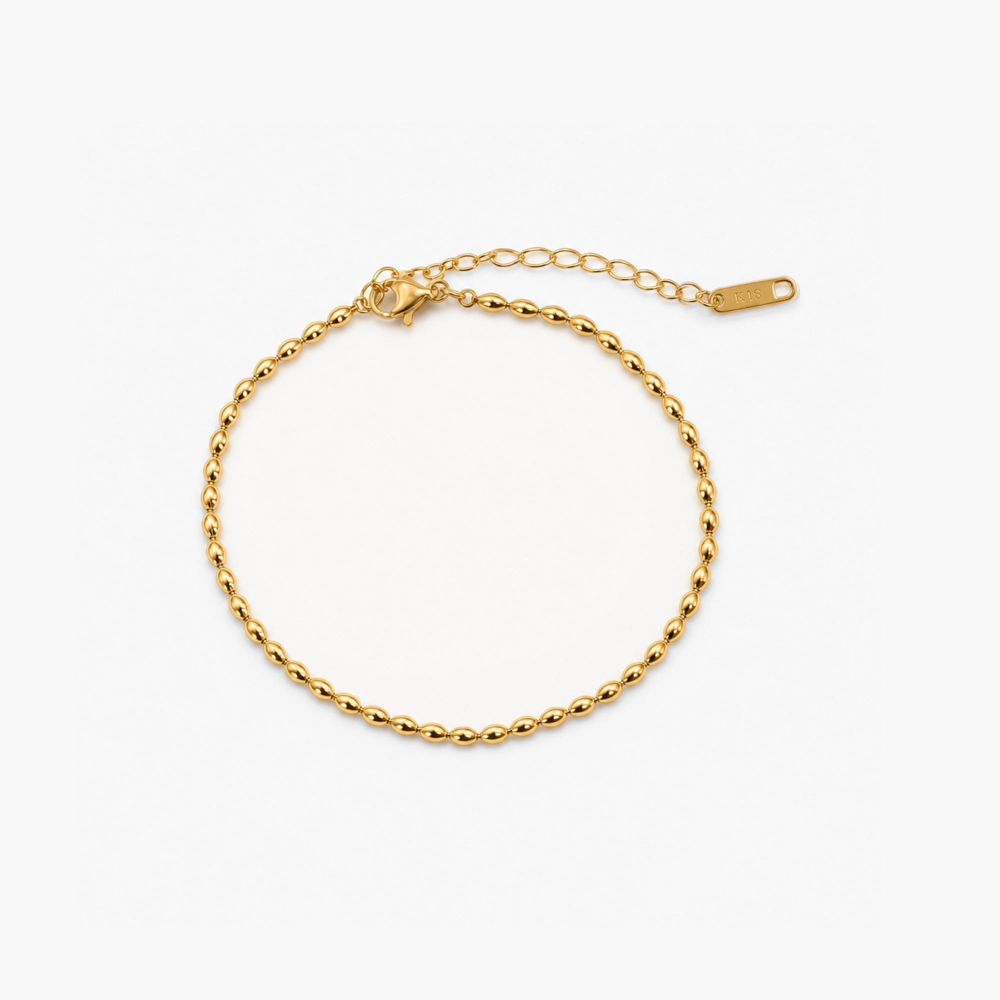 Riven Gold Anklet featuring an 18k gold plated finish with an adjustable rice bead design for a stylish and customizable fit. 0